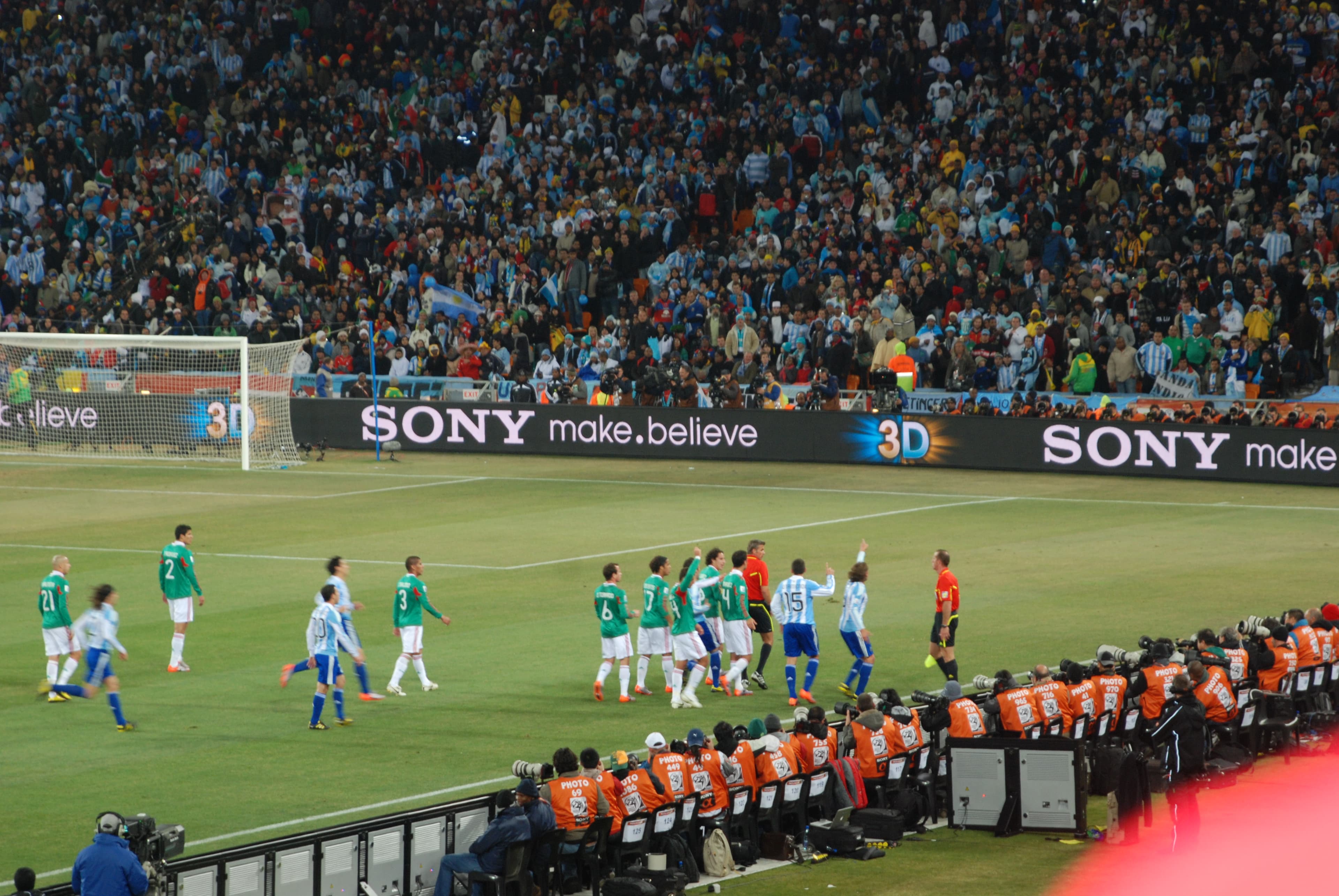 Lionel Messi charges past Mexico defenders during the 2010 round of 16 in Johannesburg.